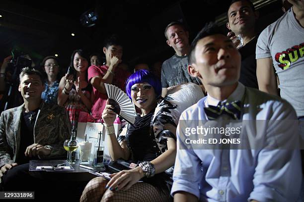 In a photo taken on October 15, 2011 'Mr. Gay Hong Kong 2011' judges Tony Wong and Coco Pop attend the competition's final pageant at the Bisous...