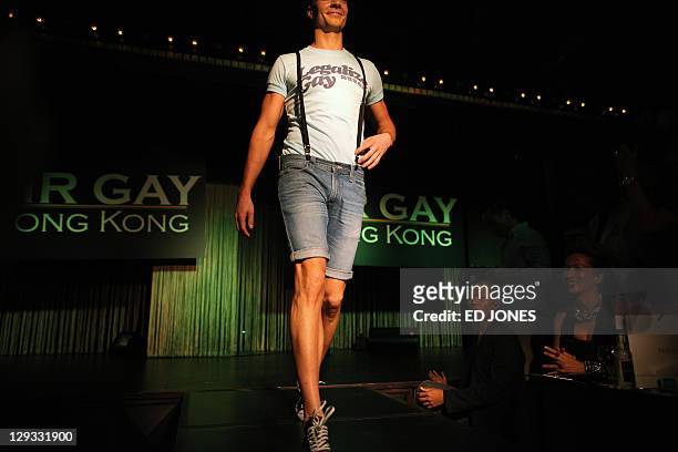 In a photo taken on October 15, 2011 'Mr. Gay Hong Kong 2011' contestant Jonathan Bridge Hudson performs in the competition's final pageant at the...