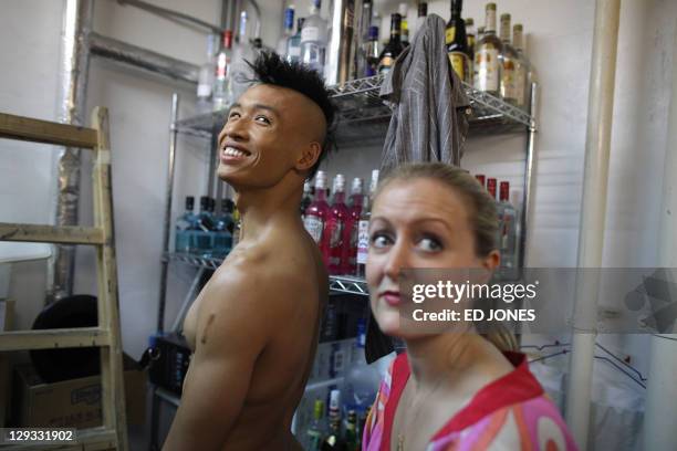 In a photo taken on October 15, 2011 'Mr. Gay Hong Kong' winner Jimmy Wong Chun prepares for his appearance in the competition's final pageant at the...