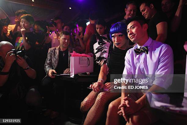 In a photo taken on October 15, 2011 'Mr. Gay Hong Kong 2011' judges Tony Wong and Coco Pop attend the competition's final pageant at the Bisous...