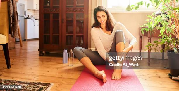 applying cream on the feet sole - calf human leg stock pictures, royalty-free photos & images