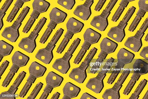 many keys on yellow background - key message stock pictures, royalty-free photos & images