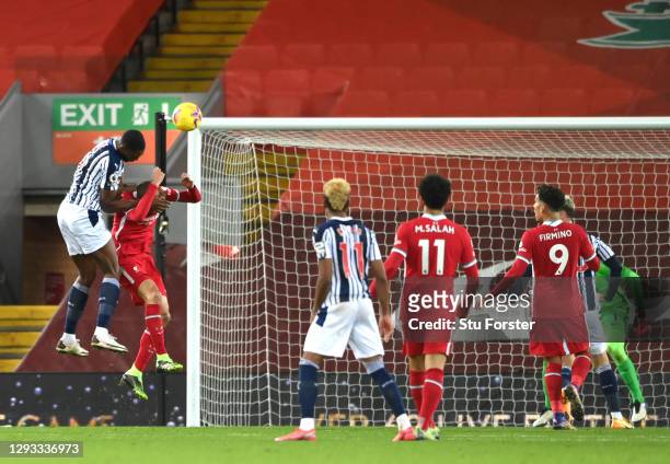 Semi Ajayi of West Bromwich Albion climbs above Fabinho of Liverpool to score their team's first goal during the Premier League match between...