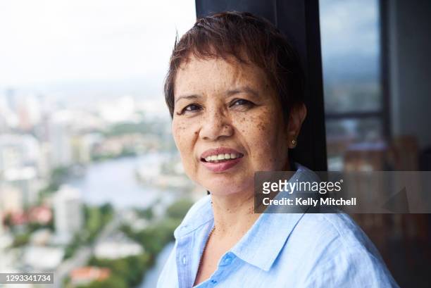 portrait of woman with view behind - hot filipina women stock pictures, royalty-free photos & images