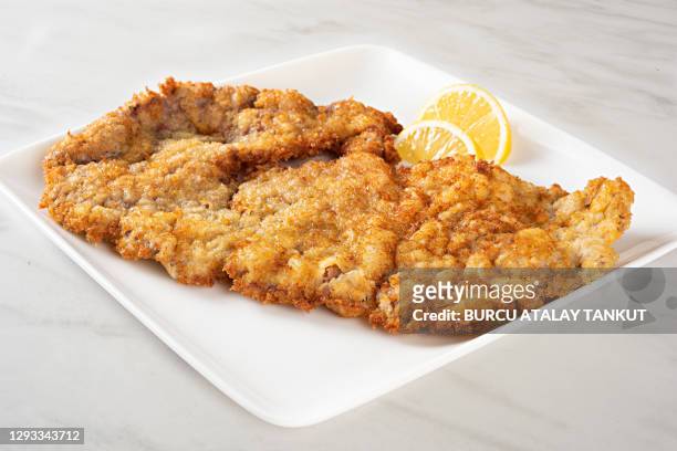 veal schnitzel on white plate - schnitzel stock pictures, royalty-free photos & images
