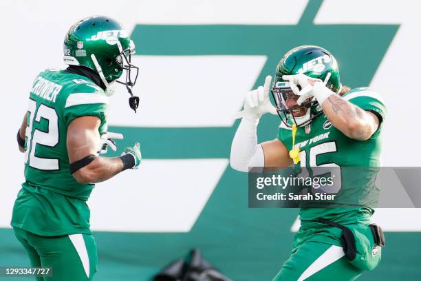 Jamison Crowder celebrates his touchdown with teammate Ty Johnson of the New York Jets in the third quarter against the Cleveland Browns at MetLife...