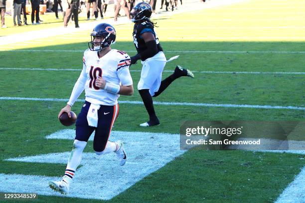 Mitchell Trubisky of the Chicago Bears scores a touchdown during the third quarter against the Jacksonville Jaguars at TIAA Bank Field on December...