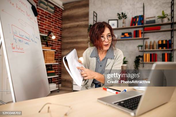 a teacher woman remote teaching during the epidemic coronavirus - english language stock pictures, royalty-free photos & images