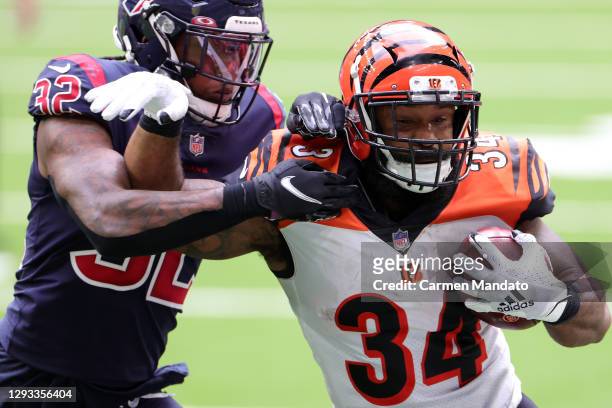 Running back Samaje Perine of the Cincinnati Bengals carries the football against cornerback Lonnie Johnson of the Houston Texans during the fourth...