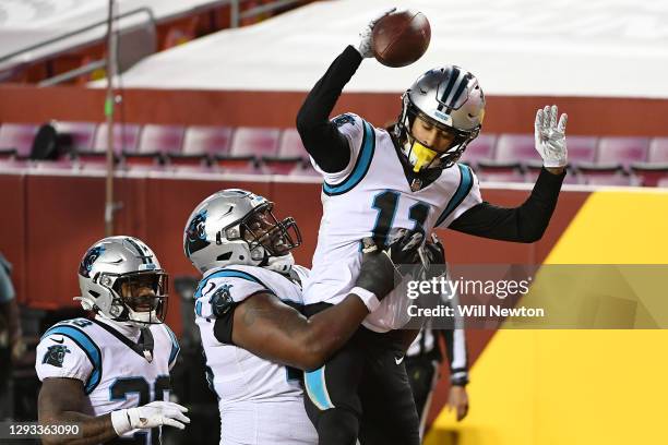 Robby Anderson of the Carolina Panthers celebrates with teammates after scoring a touchdown on a 14-yard pass from Teddy Bridgewater , against the...