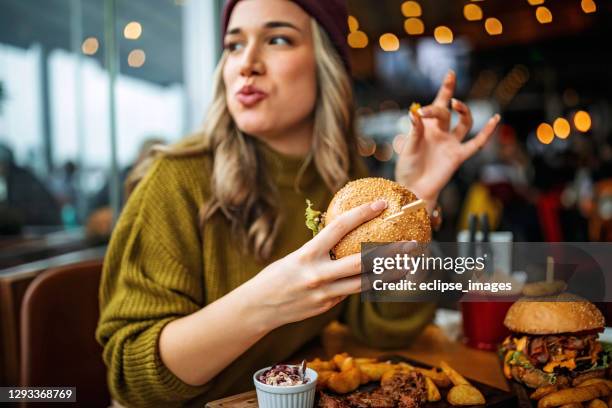 delicious burger - eating burger stock pictures, royalty-free photos & images