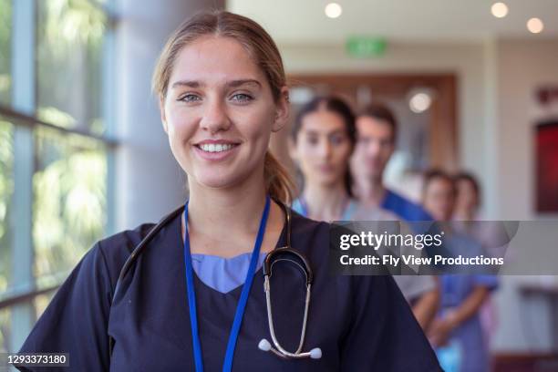 team of healthcare workers in hospital - nursing stock pictures, royalty-free photos & images