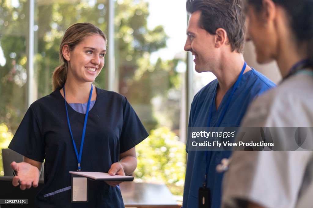 Doctors attending training course talking in conference room