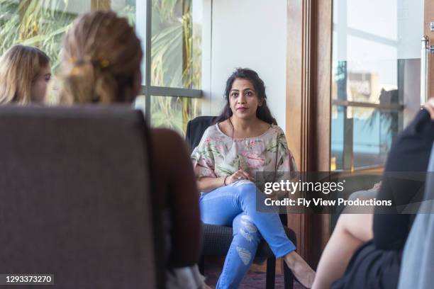 supportive members of group therapy session - indian community stock pictures, royalty-free photos & images