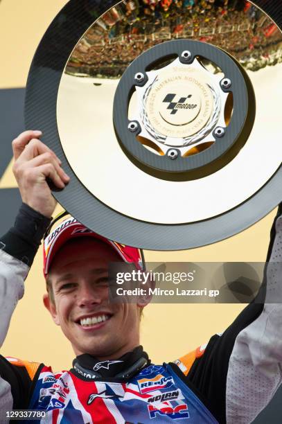 Casey Stoner of Australia and Repsol Honda Team celebrates on the podium after winning the race and the championship at the Australian MotoGP, which...