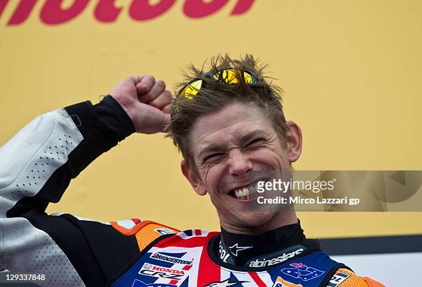 Casey Stoner of Australia and Repsol Honda Team celebrates on the podium after winning the race and the championship at the Australian MotoGP, which...