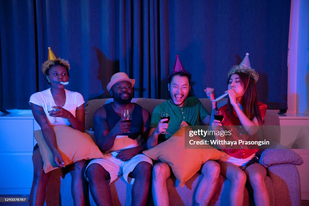 Multi-ethnic teenage girls having fun singing at slumber party