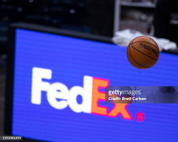 Basketball floats in front of a FedEx logo during the game between the Memphis Grizzlies and the San Antonio Spurs at FedExForum on December 23, 2020...