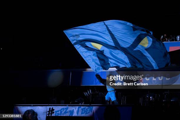 Grizz mascot of the Memphis Grizzlies waves a team flag before the game against the San Antonio Spurs at FedExForum on December 23, 2020 in Memphis,...