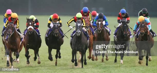 Jockey Yuichi Kitamura riding Chrono Genesis crosses the finish line to win the Arima Kinen at the Nakayama Racecourse on December 27, 2020 in...