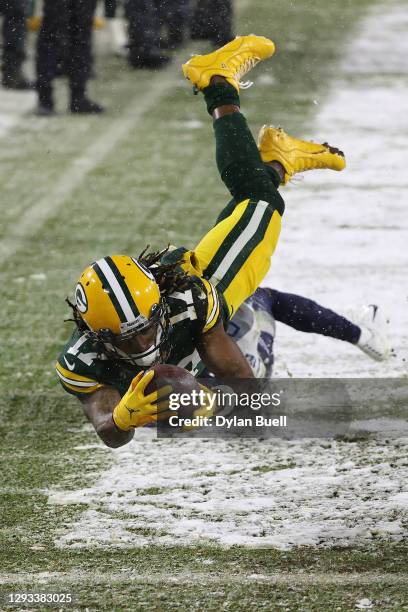 Wide receiver Davante Adams of the Green Bay Packers dives for a touchdown against cornerback Adoree' Jackson of the Tennessee Titans during the...