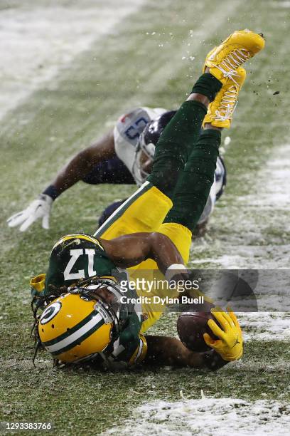 Wide receiver Davante Adams of the Green Bay Packers dives for a touchdown against cornerback Adoree' Jackson of the Tennessee Titans during the...
