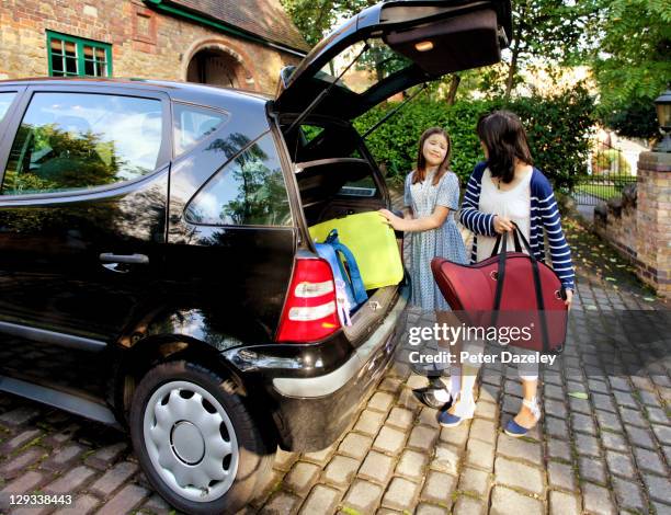 unhappy school girl going back to school - mothers bag stock pictures, royalty-free photos & images