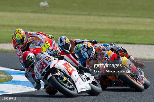Marco Simoncelli of Italy and San Carlo Honda Gresini leads the field during the MotoGP race of the Australian MotoGP, which is round 16 of the...
