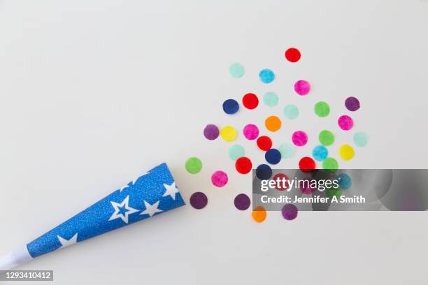 celebration - party poppers stock pictures, royalty-free photos & images