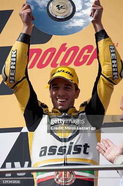 Alex De Angelis of Italy and JIR Moto2 celebrates on the podium the victory at the end of the Moto2 race of the Australian MotoGP, which is round 16...