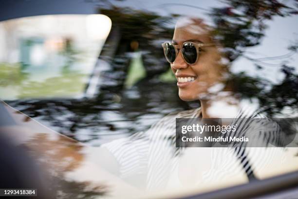 young woman driving car - new car stock pictures, royalty-free photos & images