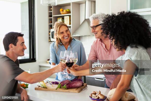 family toasting and celebrating - house warming stock pictures, royalty-free photos & images