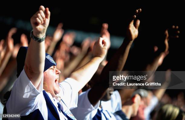 West Bromwich Albion fans celebrate the first goal scored by Chris Brunt during the Barclays Premier League match between West Bromwich Albion and...