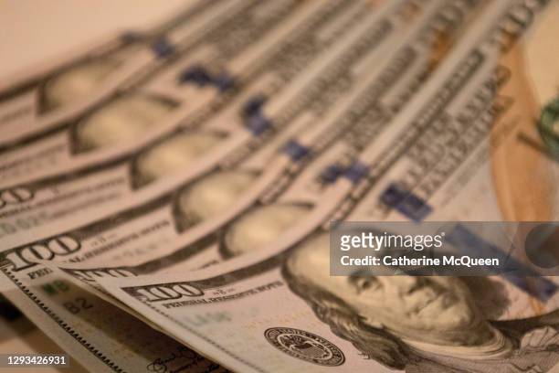 economic stimulus: six crisp $100 bills - us currency stockfoto's en -beelden