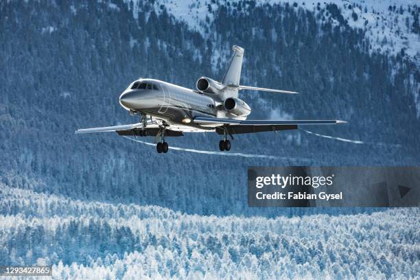 business jet arrival alps - corporate jet stock pictures, royalty-free photos & images
