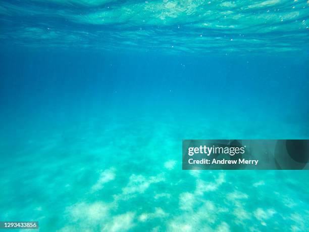 underwater clean blue, turquoise sea, wave pattern, sandy ocean floor - seabed stock pictures, royalty-free photos & images