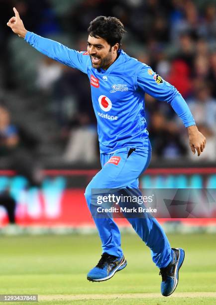 Rashid Khan of the Strikers celebrates the wicket of Chris Munro of the Scorchers during the Big Bash League match between the Perth Scorchers and...