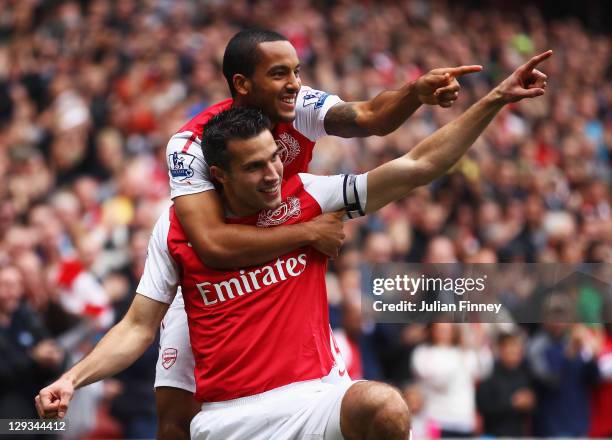 Robin van Persie of Arsenal celebrates with Theo Walcott as he scores their first goal during the Barclays Premier League match between Arsenal and...