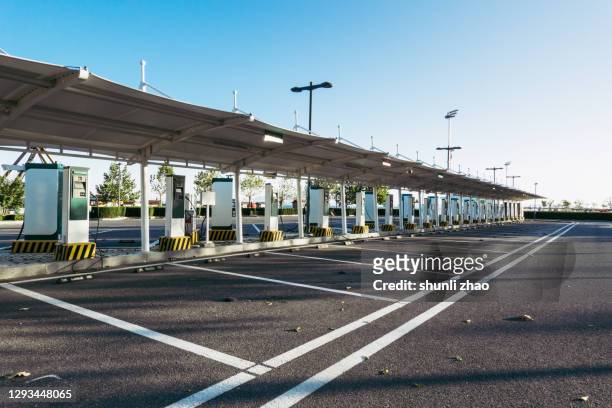 electric car charging station - station stock-fotos und bilder