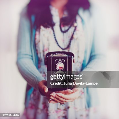 Young Woman Holding Box Camera High-Res Stock Photo - Getty Images