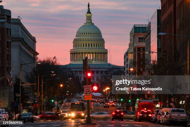 The sun rises over the US Capitol on December 28, 2020 in Washington, DC. President Donald Trump signed the Relief Bill and government funding bill...