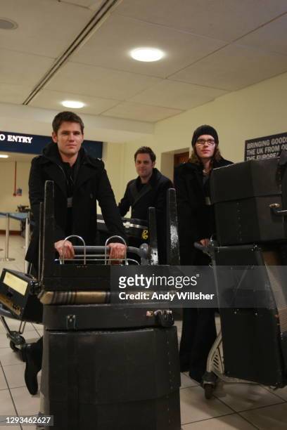 Pop band Scouting For Girls photographed at City Airport on a video shoot