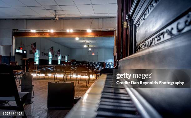 piano in aged community center and performance hall - history museum stock pictures, royalty-free photos & images