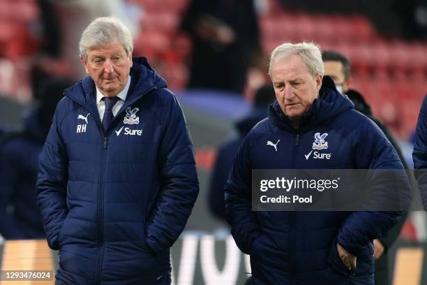 Roy Hodgson, Manager of Crystal Palace looks on as he walks towards the dressing room with Ray Lewington, Assistant Manager of Crystal Palace at half...
