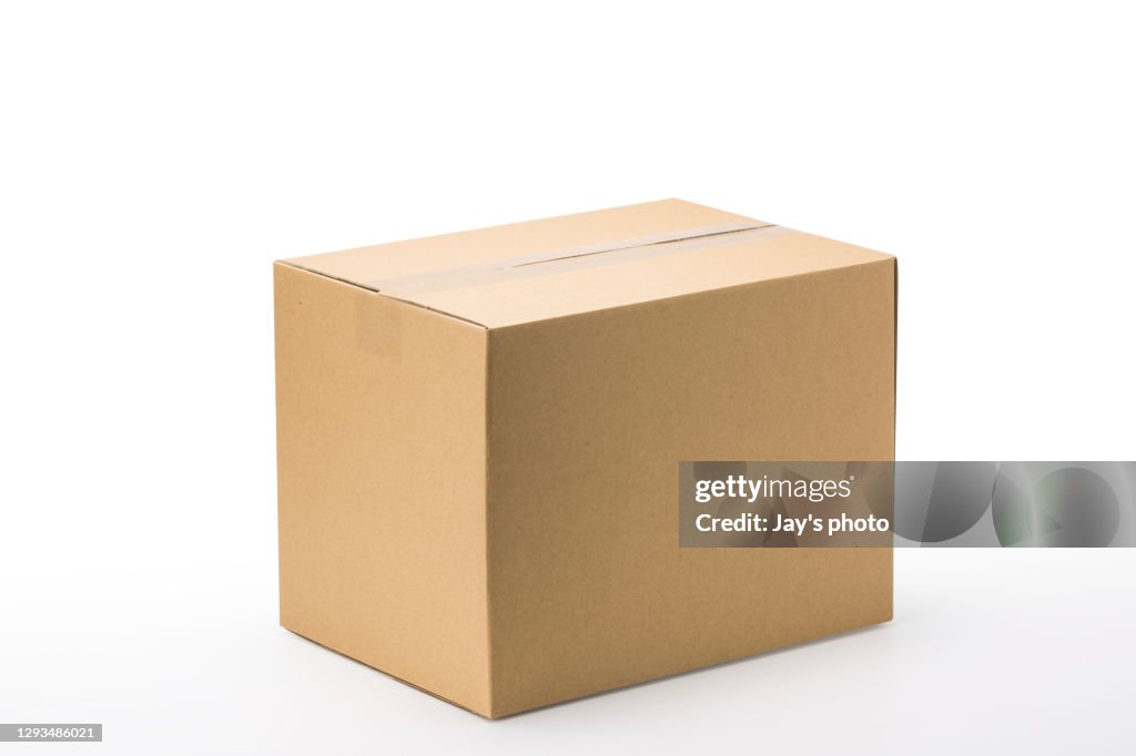 Closed up shot paper box taped and isolated on a white background.