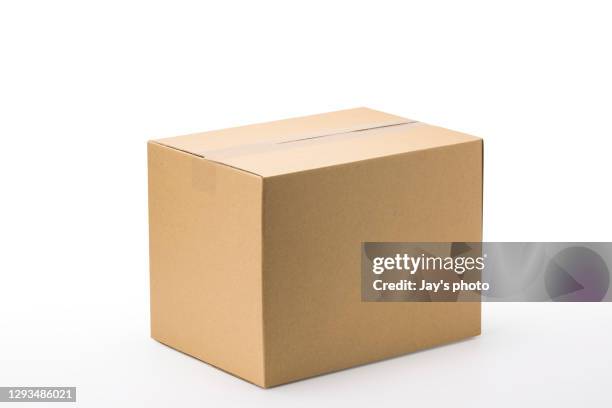 closed up shot paper box taped and isolated on a white background. - package photos et images de collection