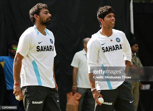Indian cricketers Praveen Kumar and Umesh Yadav during the practice session at Ferozshah Kotla Ground in Delhi, India on October 16, 2011.