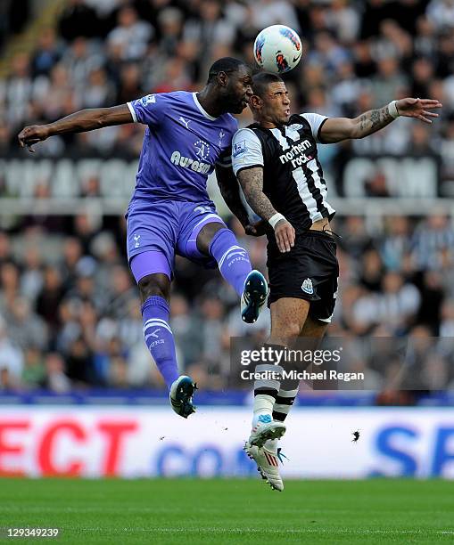 Leon Best of Newcastle United goes up for a header with Ledley King of Tottenham Hotspur during the Barclays Premier League match between Newcastle...