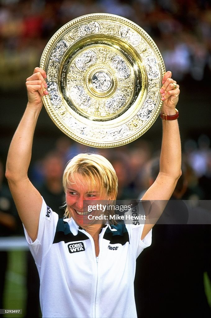 Jana Novotna of the Czech Republic holds her trophy