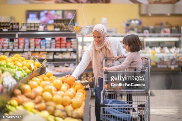 grocery shopping with mommy - lebanese ethnicity stock pictures, royalty-free photos & images